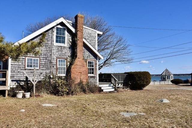 view of side of home with a chimney