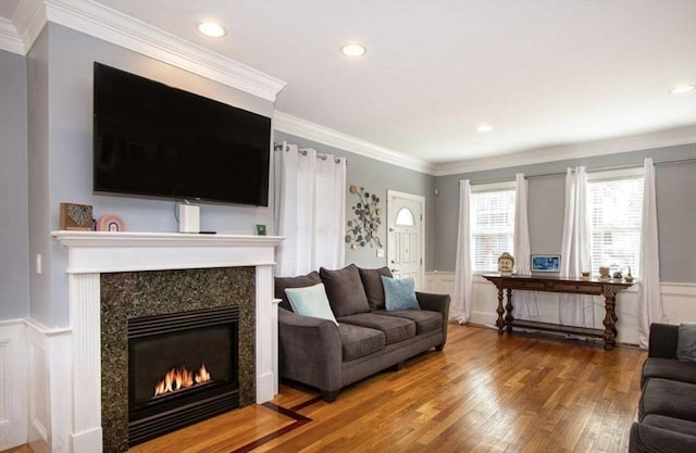 857 Adams St Unit 857, Boston, MA 02124 - living area with a high end fireplace, wood finished floors, a decorative wall, wainscoting, and recessed lighting