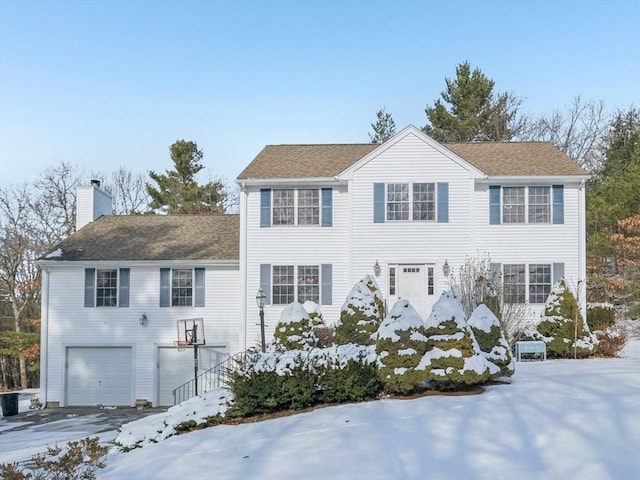 colonial house featuring a garage