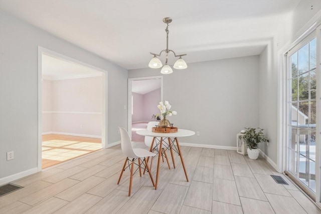 dining room with a notable chandelier