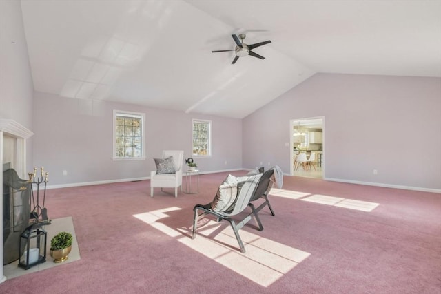 sitting room featuring ceiling fan, light colored carpet, and lofted ceiling