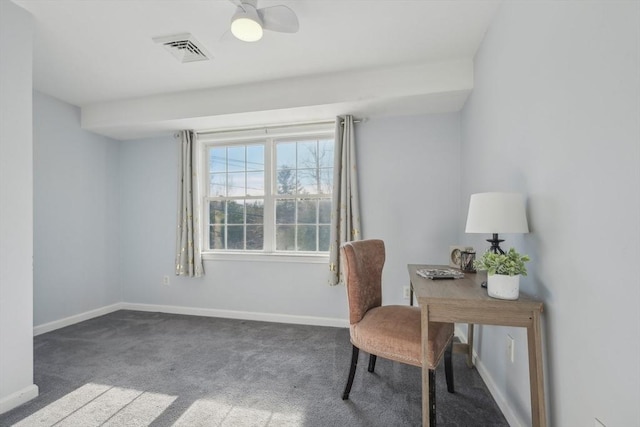 carpeted home office featuring ceiling fan