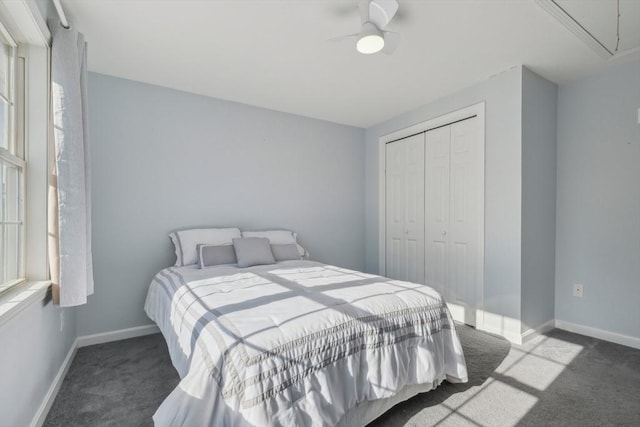 carpeted bedroom with a closet and ceiling fan