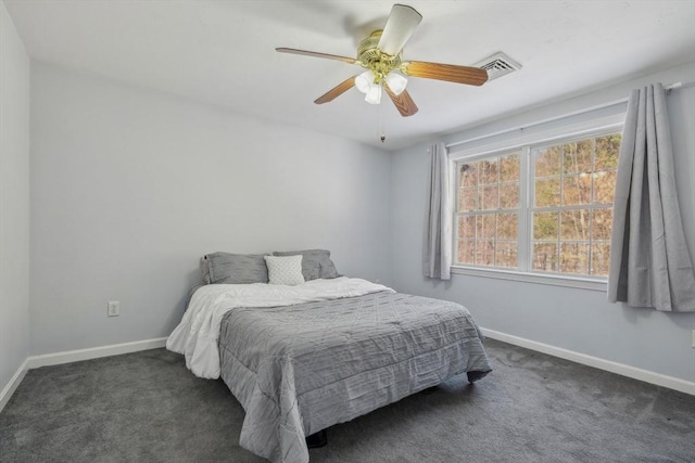 bedroom featuring dark carpet and ceiling fan