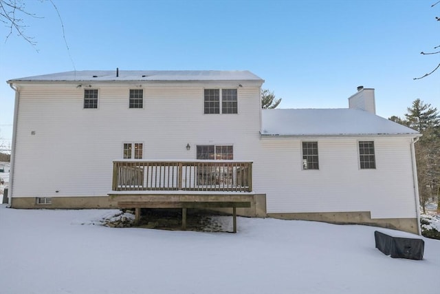 snow covered property featuring a deck