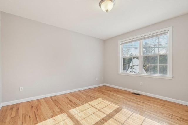 spare room featuring light hardwood / wood-style flooring