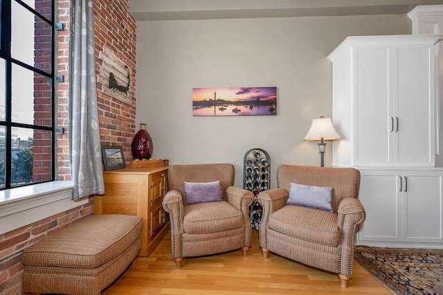 sitting room featuring light hardwood / wood-style flooring