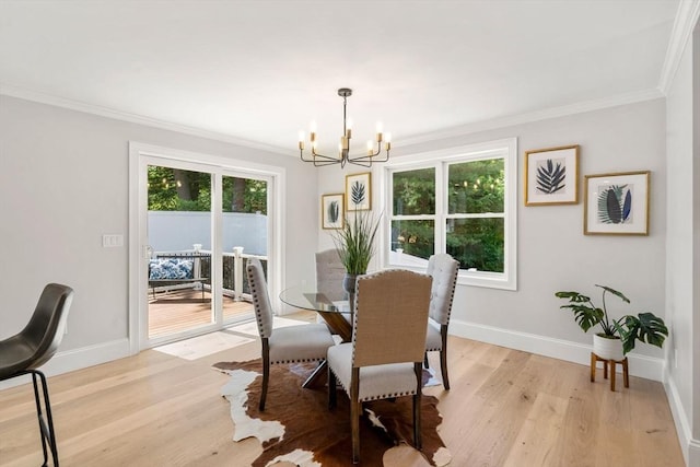 2 Suncrest Ave, Wilmington, MA 01887 - dining room featuring a chandelier, ornamental molding, healthy amount of natural light, and light wood-style floors