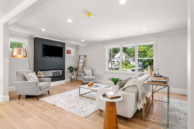 2 Suncrest Ave, Wilmington, MA 01887 - living room featuring crown molding, a large fireplace, recessed lighting, and light wood-type flooring