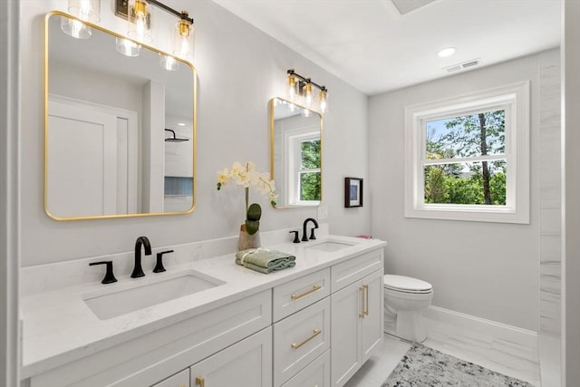 2 Suncrest Ave, Wilmington, MA 01887 - full bathroom featuring marble look tile flooring, double vanity, and healthy amount of natural light