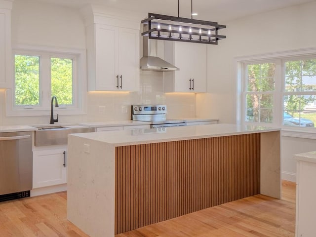 28 Berkshire Ave, Sharon, MA 02067 - kitchen featuring stainless steel appliances, light wood-style flooring, wall chimney exhaust hood, and white cabinets