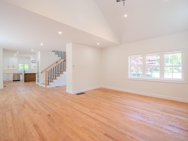 28 Berkshire Ave, Sharon, MA 02067 - spare room with stairs, recessed lighting, light wood-style flooring, and vaulted ceiling