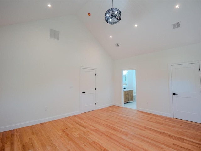 28 Berkshire Ave, Sharon, MA 02067 - empty room with high vaulted ceiling, light wood-type flooring, and recessed lighting