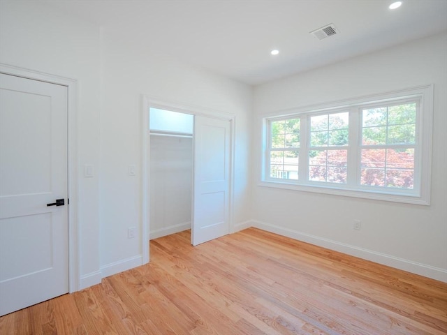 28 Berkshire Ave, Sharon, MA 02067 - unfurnished bedroom with light wood-style flooring, recessed lighting, and a closet