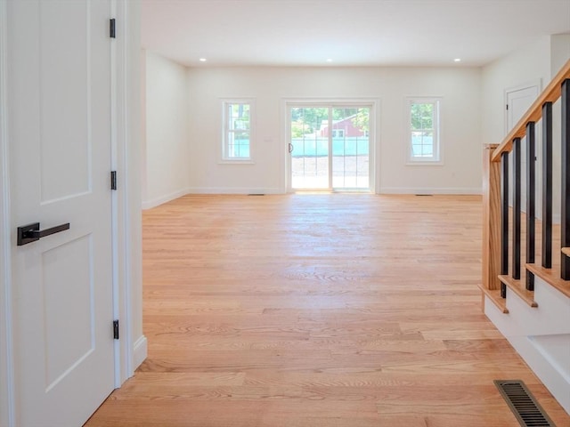 28 Berkshire Ave, Sharon, MA 02067 - unfurnished living room with light wood-style floors, stairway, and recessed lighting