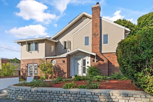 back of property featuring a garage