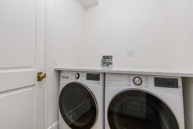 washroom with washer and clothes dryer