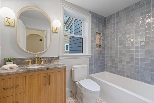 full bathroom with toilet, vanity, and bathing tub / shower combination