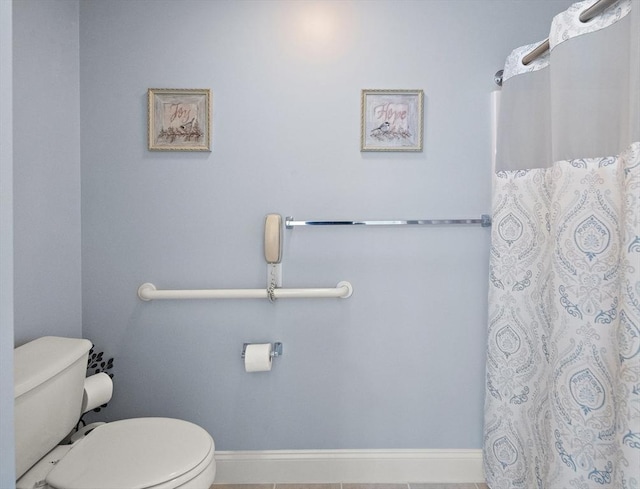 bathroom featuring tile patterned flooring and toilet