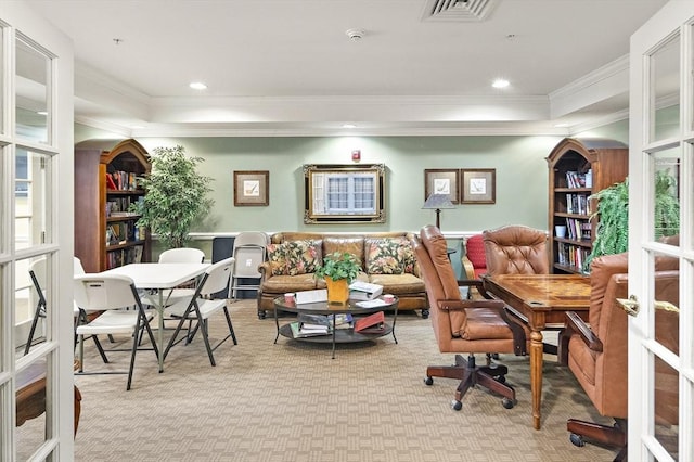 office space with light carpet, french doors, and crown molding