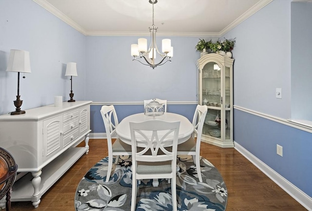 dining space featuring a notable chandelier, dark hardwood / wood-style floors, and crown molding