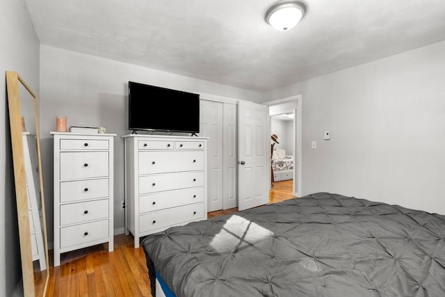 bedroom featuring a closet and wood finished floors