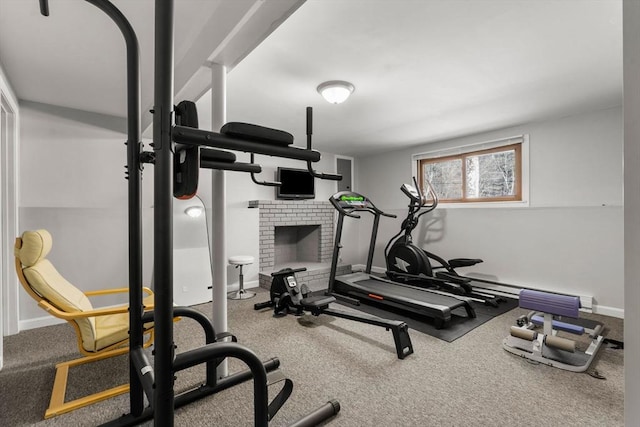 workout area featuring baseboards