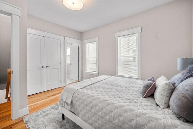 bedroom featuring a closet and hardwood / wood-style flooring