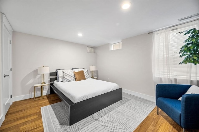 bedroom with wood-type flooring