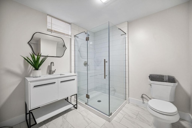 bathroom with vanity, an enclosed shower, and toilet