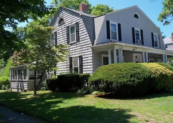 view of property exterior featuring cooling unit and a yard