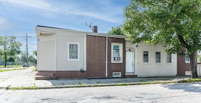 51 Felton, New Bedford, MA 02745 - view of front facade with entry steps, a chimney, and concrete driveway