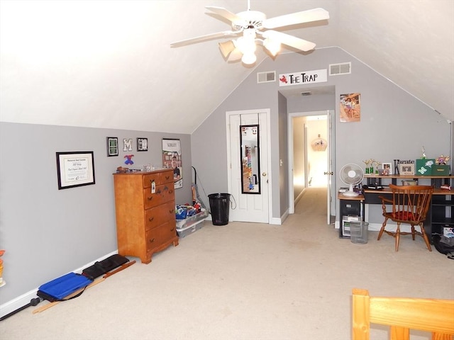 carpeted home office with ceiling fan and lofted ceiling