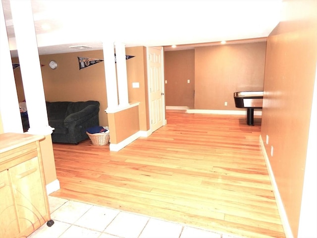 corridor with light hardwood / wood-style floors