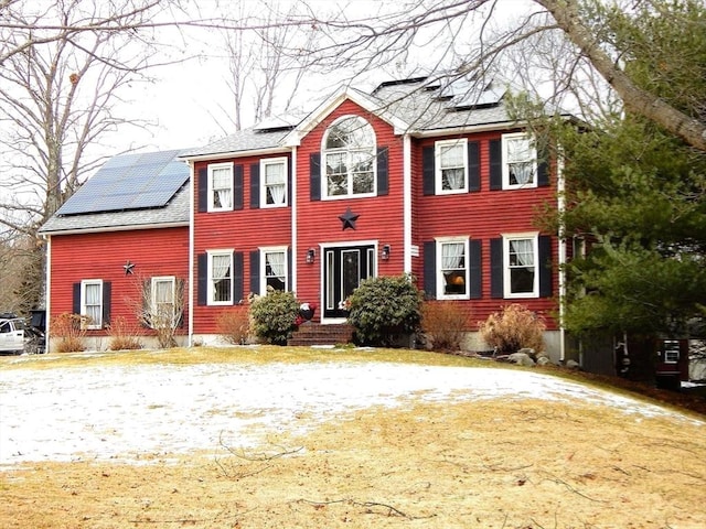 colonial inspired home with solar panels