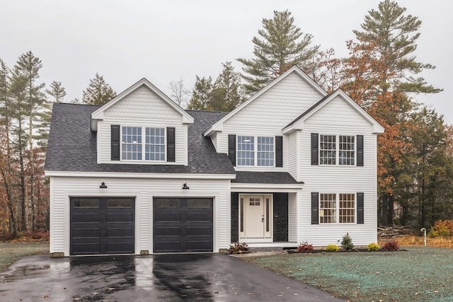 view of front of property with a garage