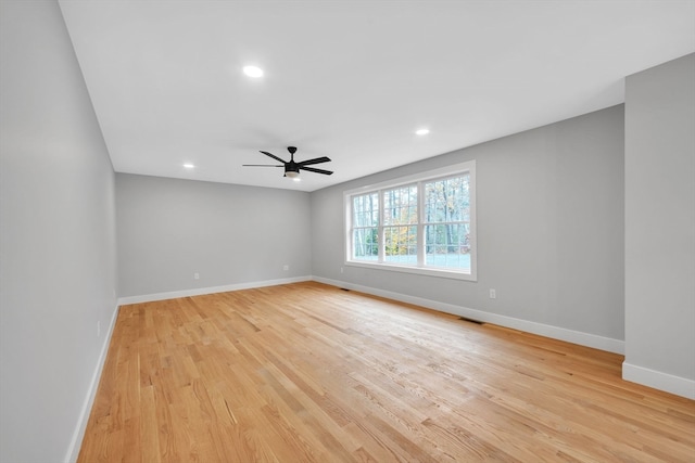 unfurnished room featuring light hardwood / wood-style floors and ceiling fan