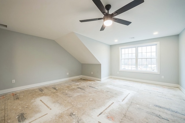 additional living space featuring ceiling fan and lofted ceiling