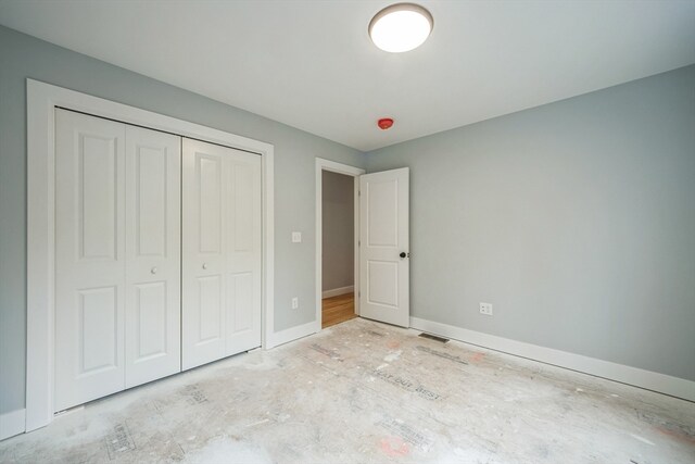 unfurnished bedroom featuring a closet