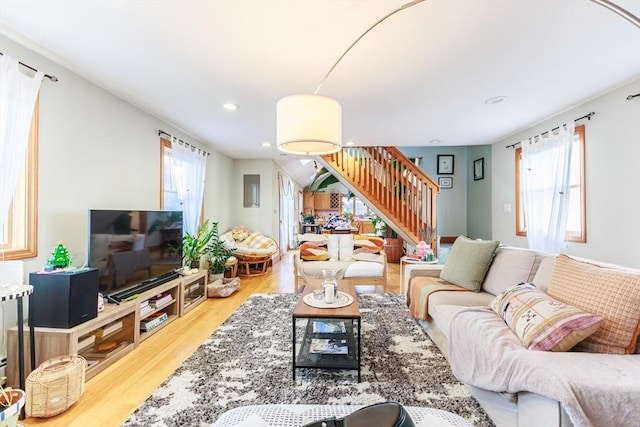 living room with a wealth of natural light and hardwood / wood-style floors