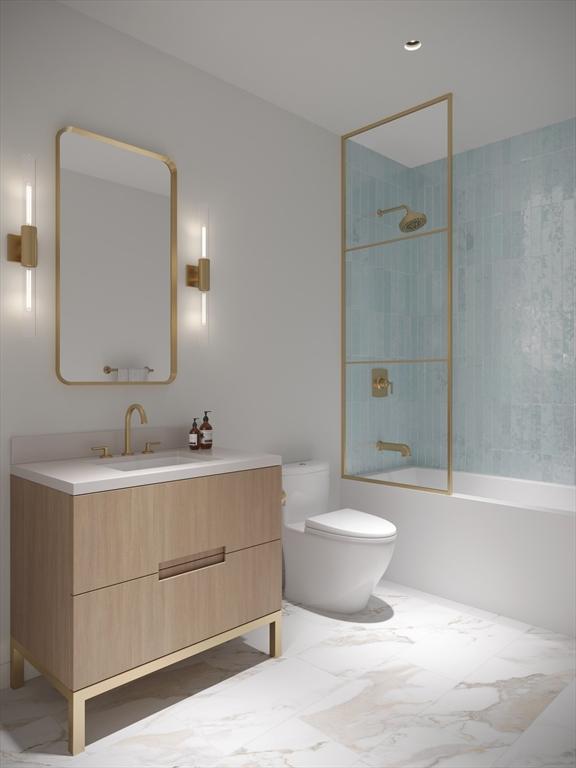 full bathroom featuring toilet, vanity, and tiled shower / bath