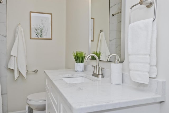 full bath featuring toilet, a marble finish shower, visible vents, and vanity