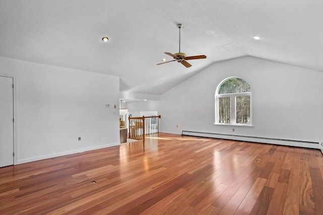 unfurnished living room featuring wood finished floors, a baseboard radiator, baseboards, ceiling fan, and vaulted ceiling