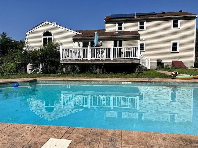 outdoor pool featuring a deck