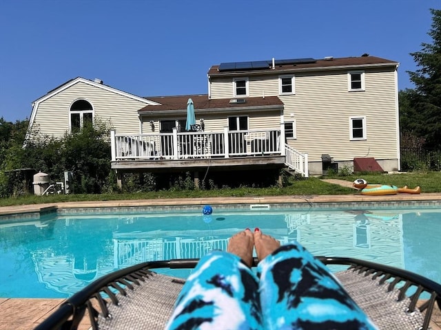 outdoor pool featuring a deck