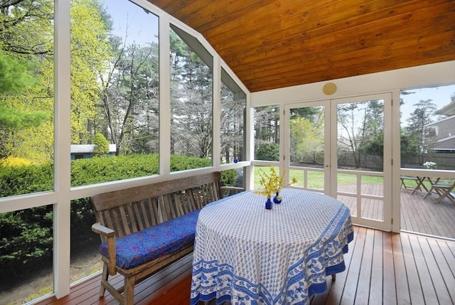 sunroom / solarium featuring outdoor dining space