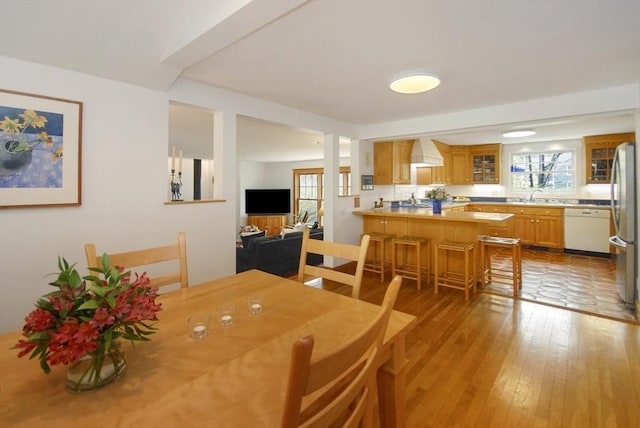 dining area featuring light wood-style floors