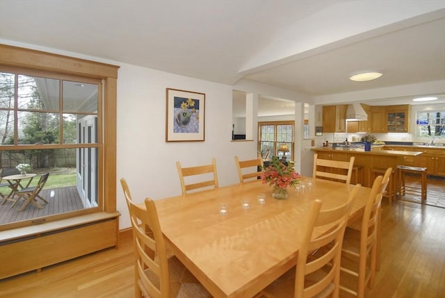 dining space featuring light wood-style flooring