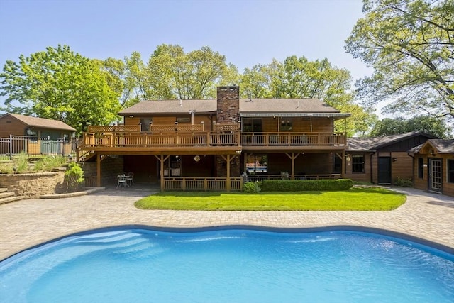 198 Mountain View Dr, Holyoke, MA 01040 - rear view of property with a chimney, an outdoor pool, a patio, and a wooden deck