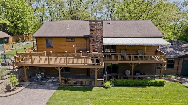 198 Mountain View Dr, Holyoke, MA 01040 - rear view of house featuring a yard, a patio, a chimney, and a deck